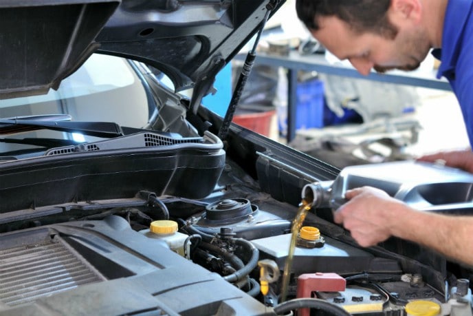 Mechanic changing oil